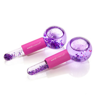 A pair of translucent purple Cryo Facial Treatment Massage Globes, filled with glitter and liquid, featuring round bulbs and cylindrical handles with "Almost Famous" written in white text. Perfect for enhancing your skincare routine, these beauty tools also have a pink segment imprinted with the brand's name.