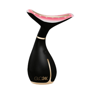 Introducing the Skin Rejuvenation LED Beauty Device (for Face & Neck) by GLO24K, an electronic marvel with a sleek black and gold design. Its unique curved shape features a broad, rounded top that glows with pink LED Light Therapy Technology, delivering age-defying benefits. This futuristic device is perfect for advanced skincare treatments.